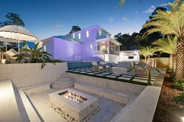 an aerial view of a house with a yard