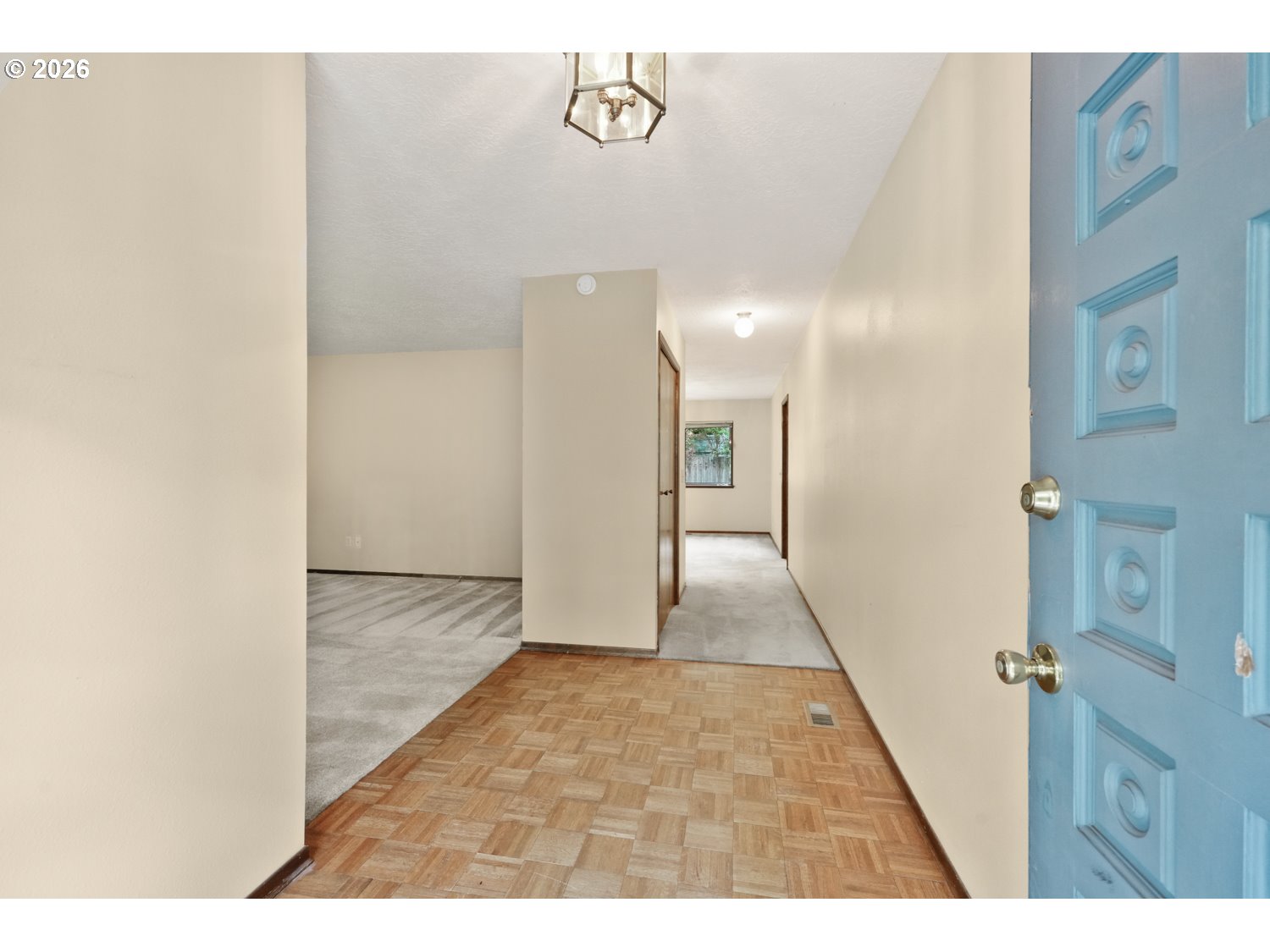 14155 Southwest 27th Street Beaverton, OR 97008 - Photo 3 of 27 a view of a hallway with wooden floor