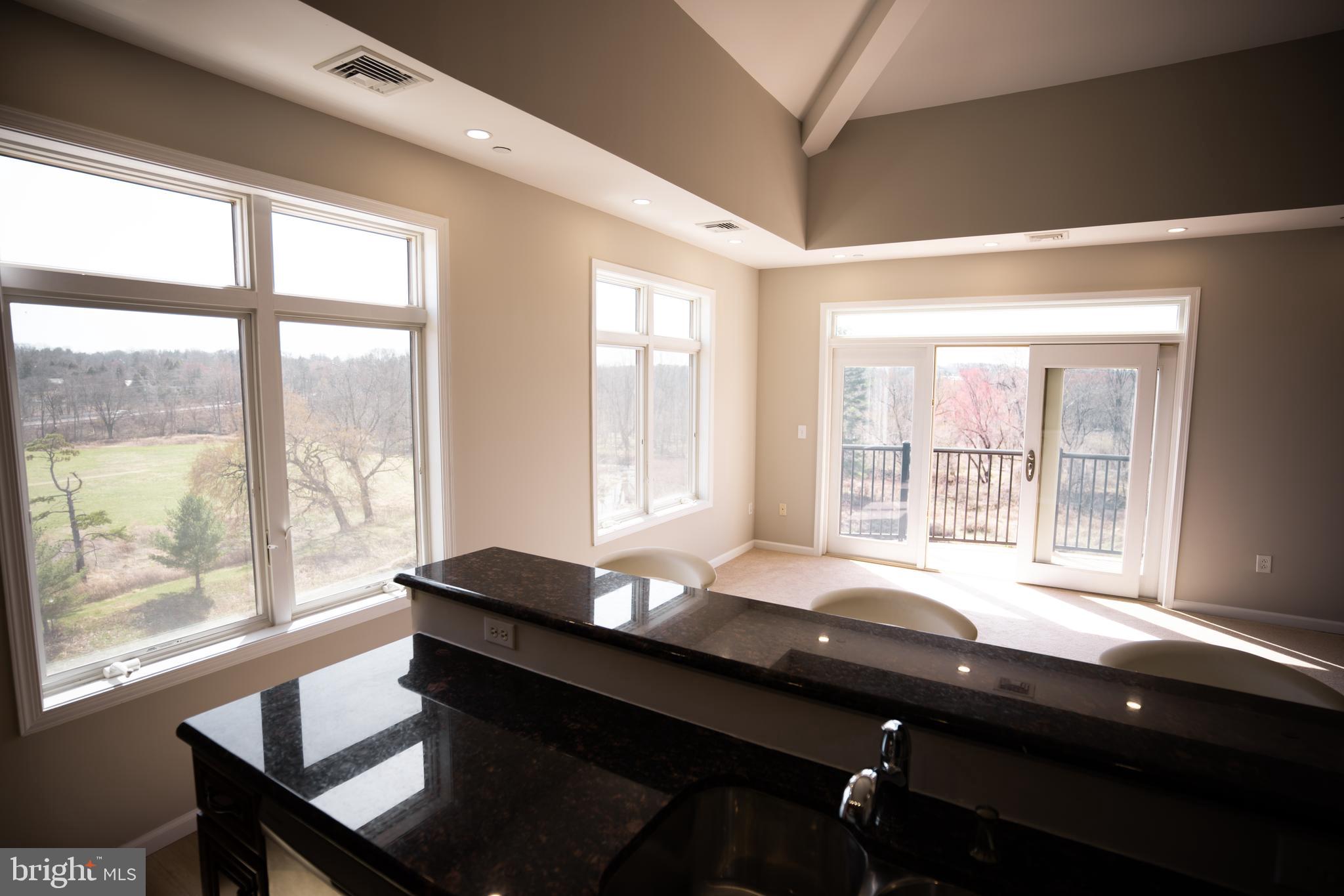 528 Carson Terrace Huntingdon Valley, PA 19006 - Photo 14 of 43 a room with a large window table and chairs