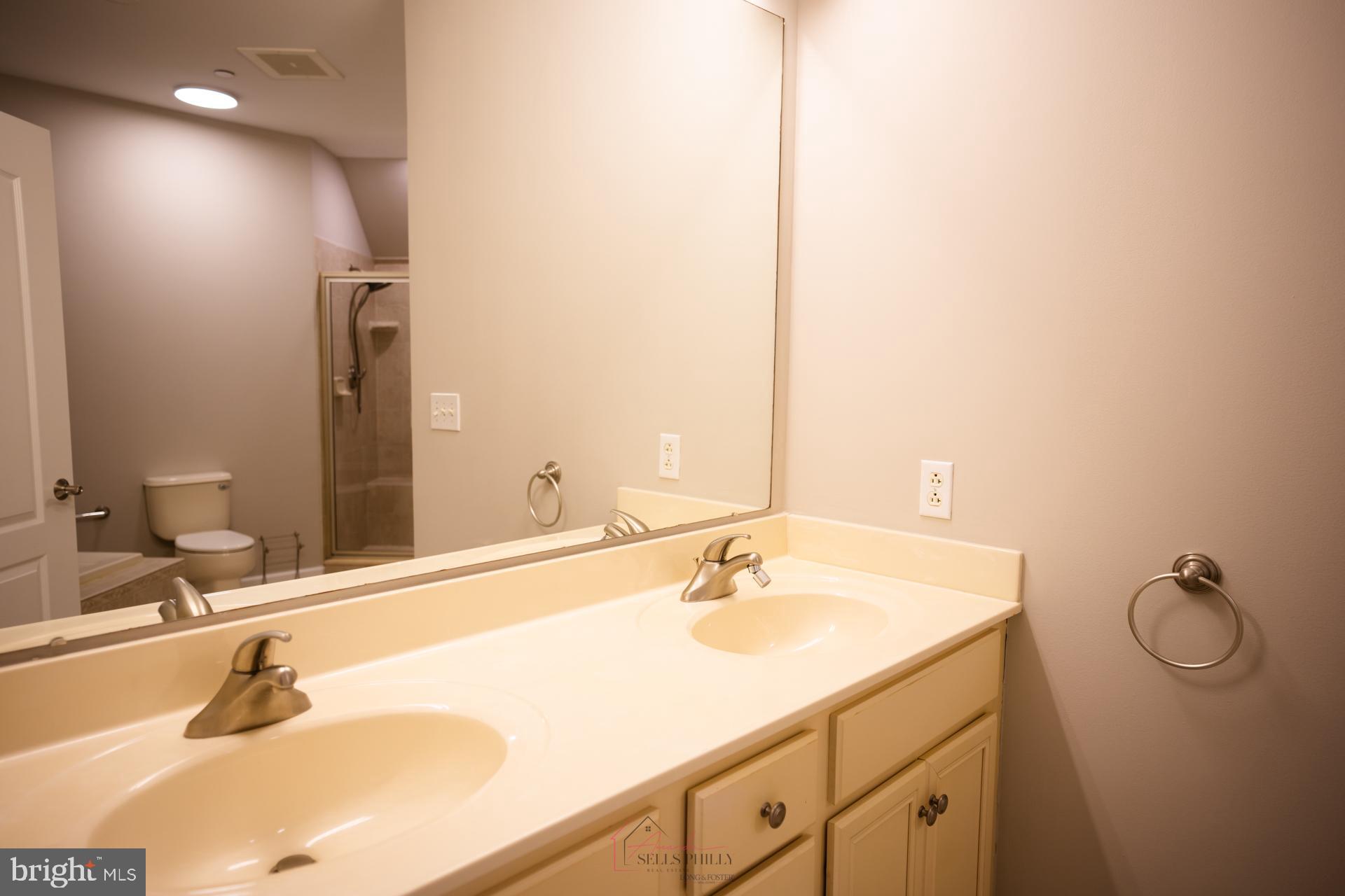 528 Carson Terrace Huntingdon Valley, PA 19006 - Photo 26 of 43 a bathroom with a sink and a mirror