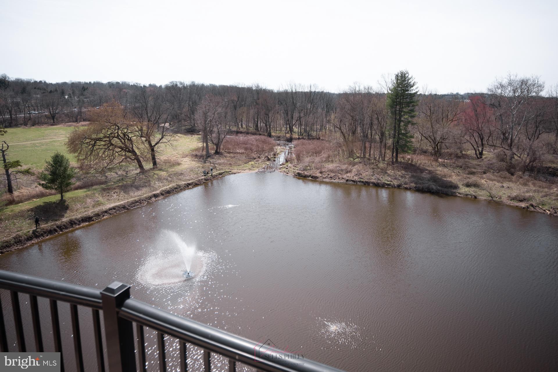 528 Carson Terrace Huntingdon Valley, PA 19006 - Photo 29 of 43 a view of a lake with a mountain in the background