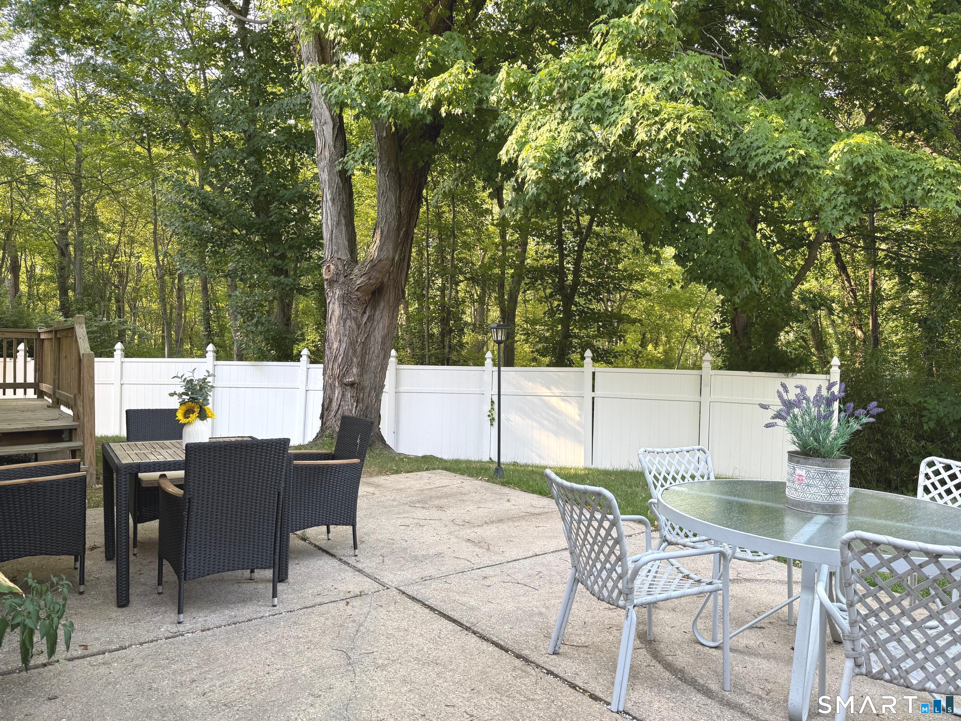 5 Griffith Road Greenwich, CT 06878 - Photo 29 of 34 Enjoy the private deck, patio and fenced backyard, perfect for outdoor dining, relaxing, or entertaining.