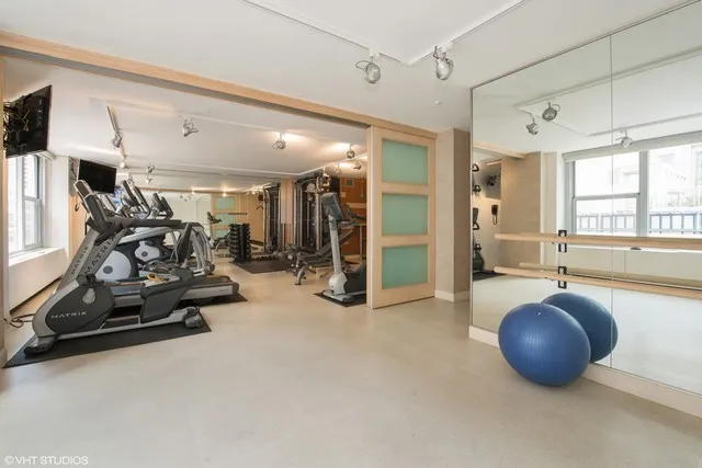 a view of an outdoor dining space with a table and chairs