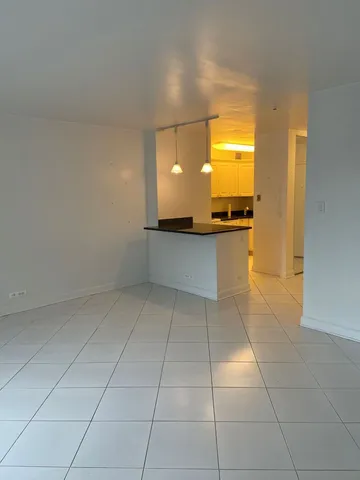 a view of a kitchen with a sink and a stove top oven