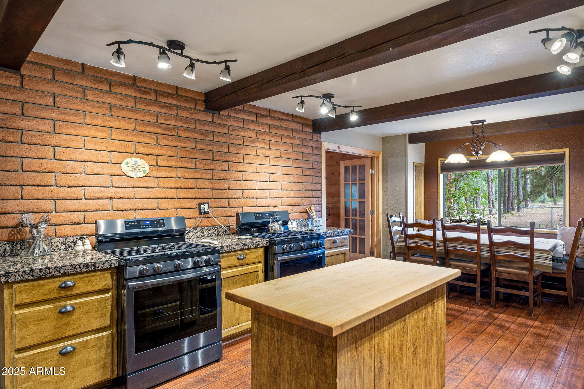 2444 South Jan Lane Pinetop, AZ 85935 - Photo 11 of 61 a kitchen that has a stove and a table