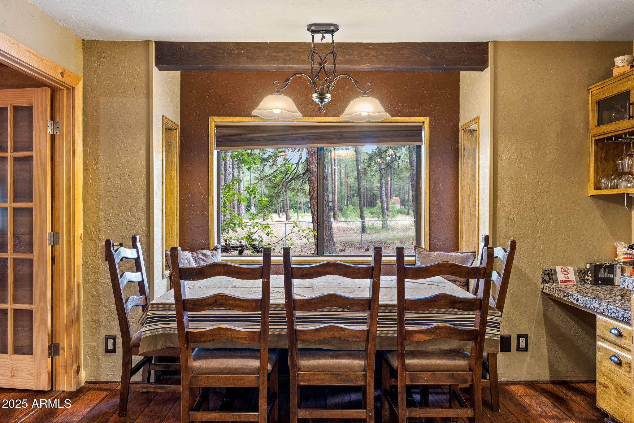 2444 South Jan Lane Pinetop, AZ 85935 - Photo 14 of 61 a view of a dining room with furniture and window