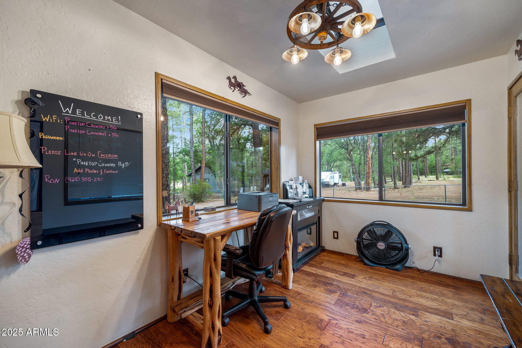 2444 South Jan Lane Pinetop, AZ 85935 - Photo 15 of 61 a view of a livingroom with furniture window and outside view