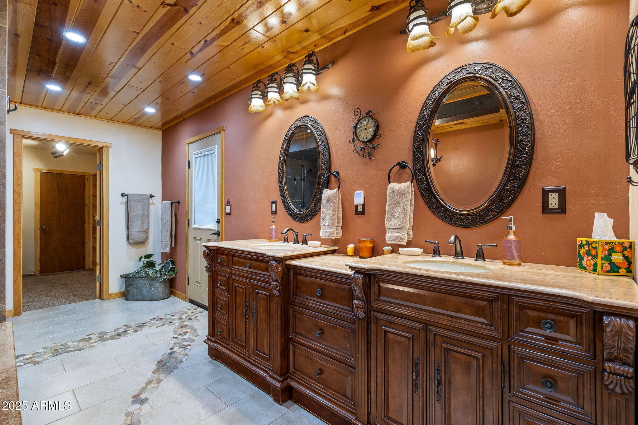 2444 South Jan Lane Pinetop, AZ 85935 - Photo 19 of 61 a bathroom with a double vanity sink and a mirror