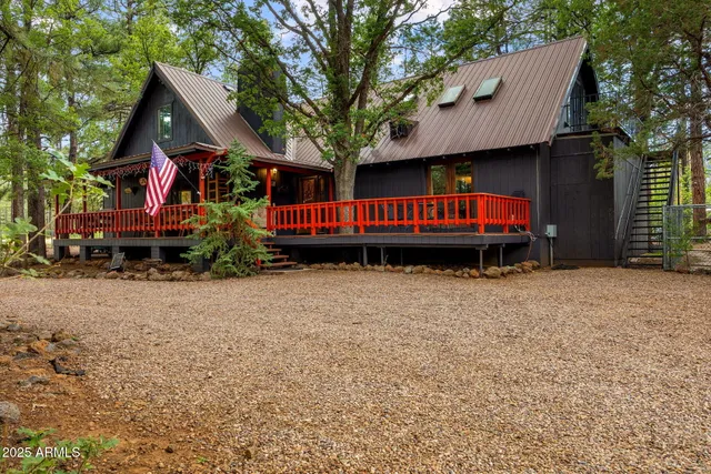 a view of a house with a yard and deck