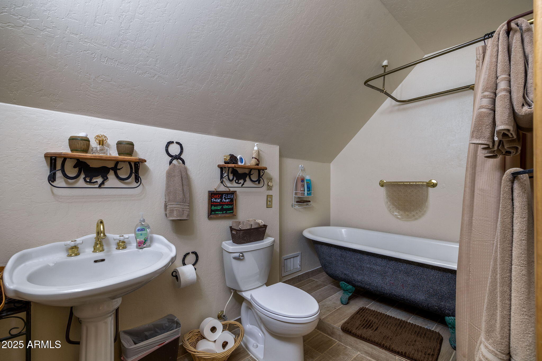 2444 South Jan Lane Pinetop, AZ 85935 - Photo 35 of 61 a bathroom with a sink toilet and a mirror