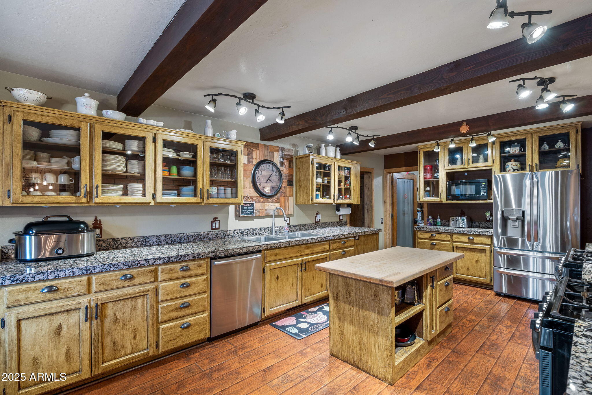 2444 South Jan Lane Pinetop, AZ 85935 - Photo 4 of 61 a kitchen with stainless steel appliances granite countertop a stove and a sink