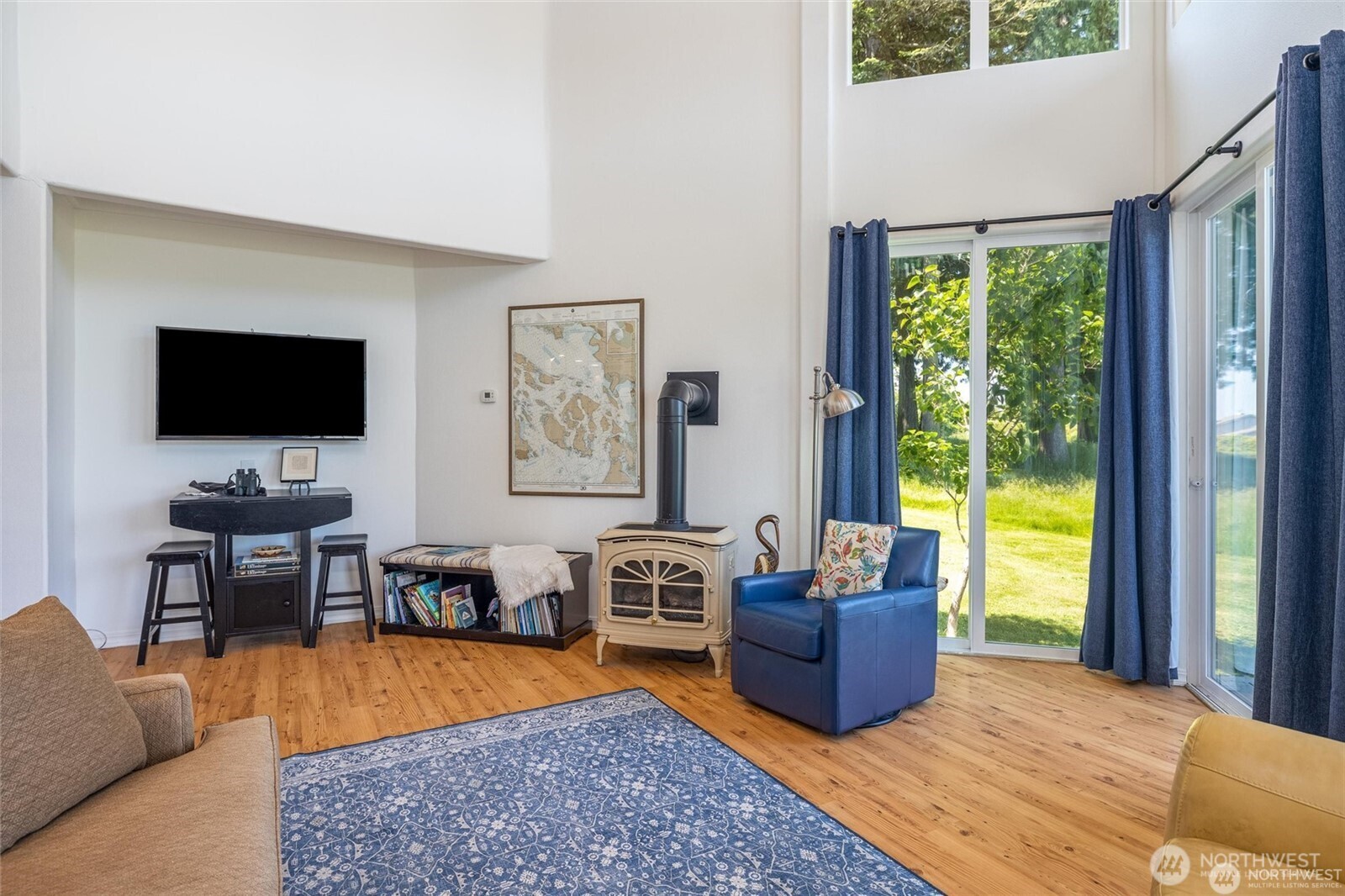 2877 North Nugent Road, Unit M4 Lummi Island, WA 98262 - Photo 9 of 31 a living room with furniture and a flat screen tv