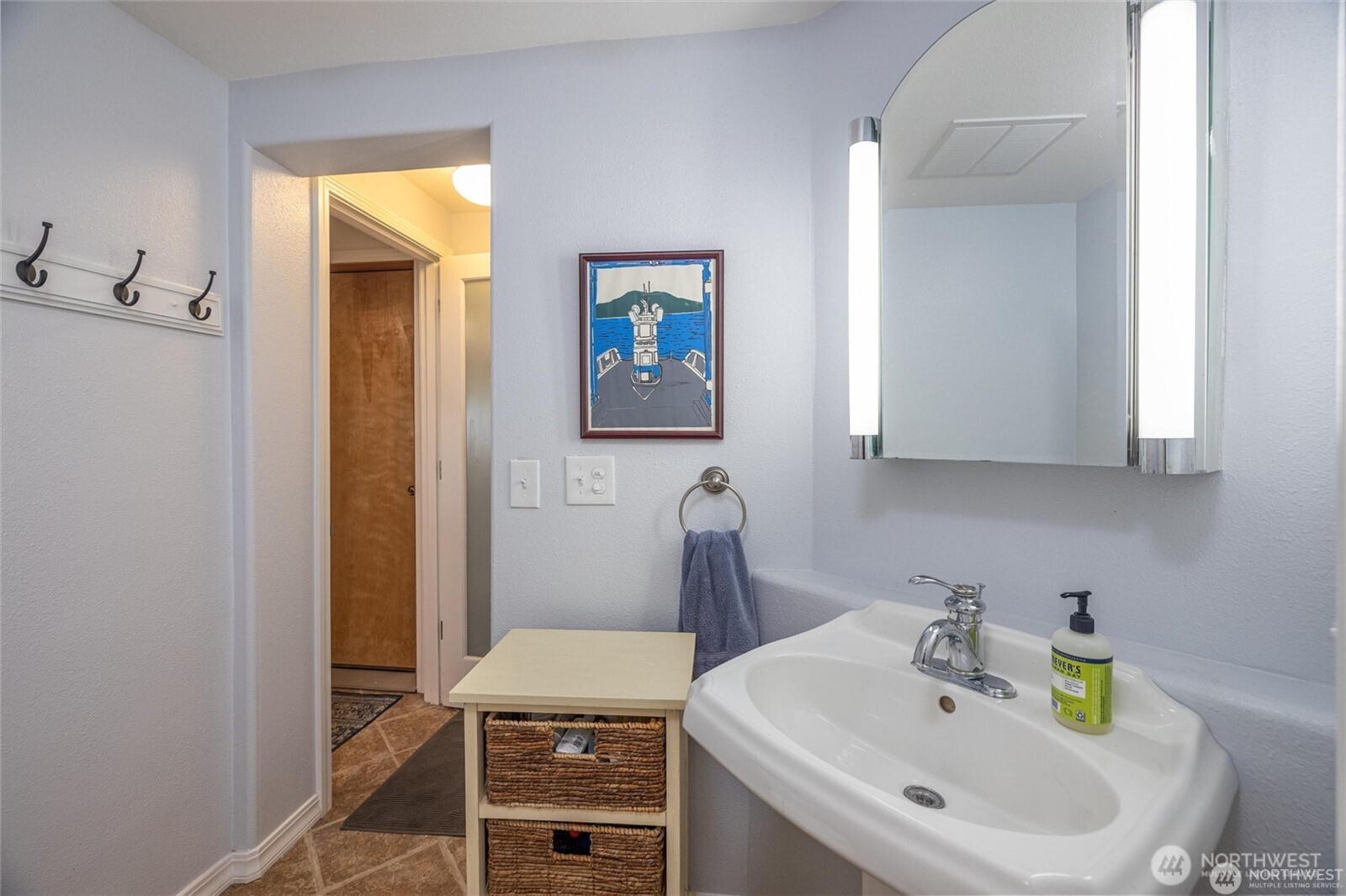 2877 North Nugent Road, Unit M4 Lummi Island, WA 98262 - Photo 10 of 31 a bathroom with a sink and a mirror
