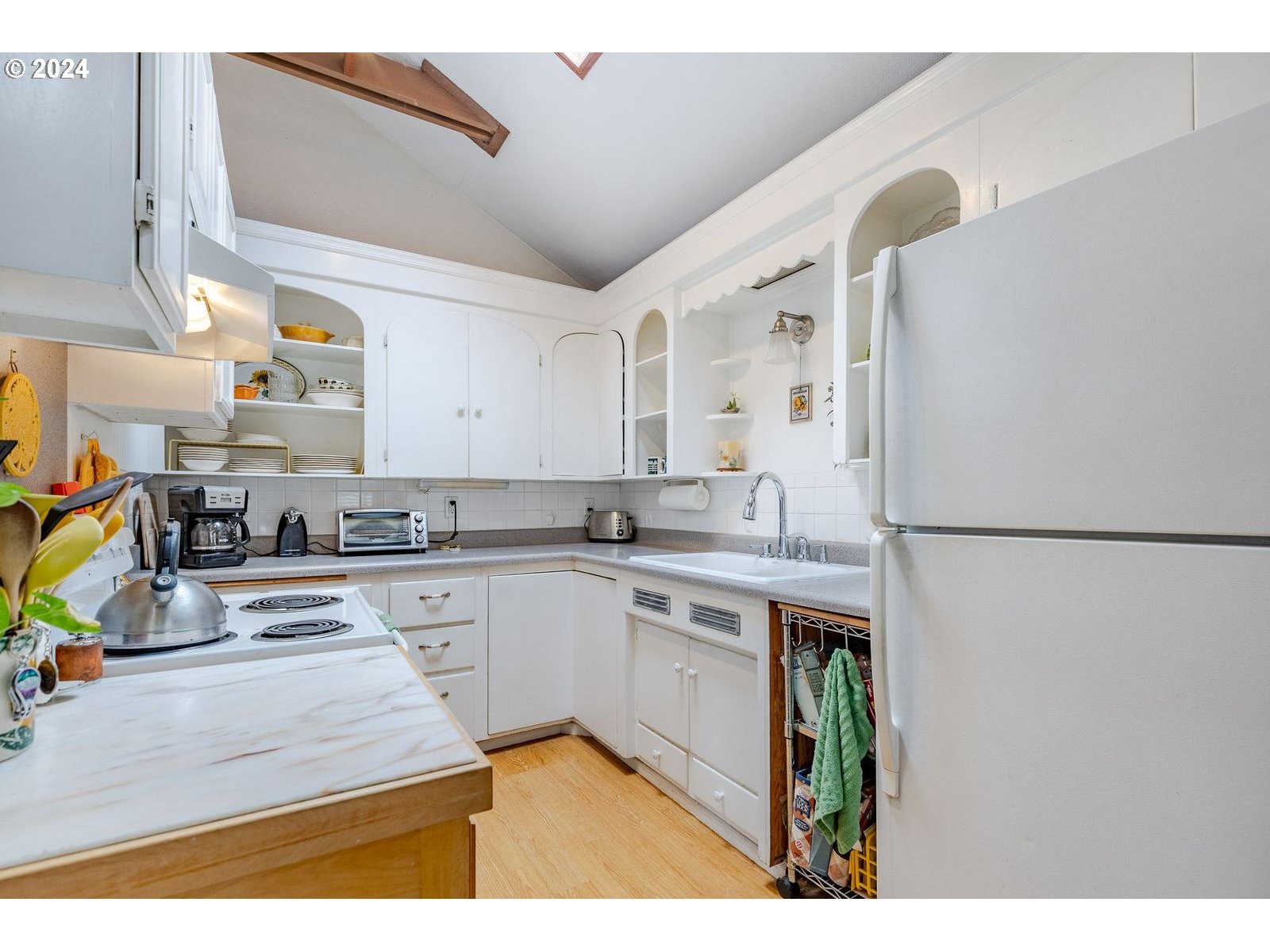 1450 Bogart Lane Eugene, OR 97401 - Photo 13 of 34 a kitchen with stainless steel appliances a stove a sink and a refrigerator