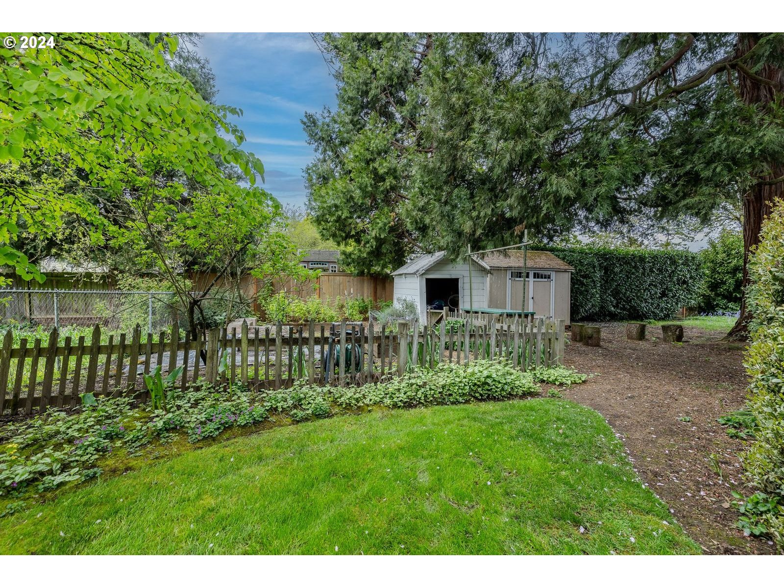 1450 Bogart Lane Eugene, OR 97401 - Photo 30 of 34 a front view of a house with a garden