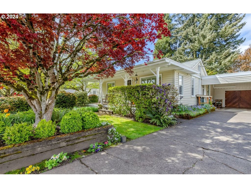 1450 Bogart Lane Eugene, OR 97401 - Photo 4 of 34 a front view of a house with a garden