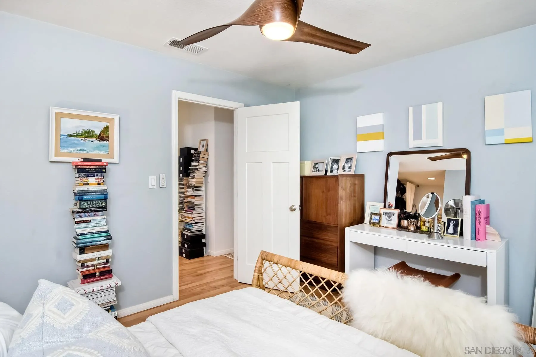 1161 Balour Drive Encinitas, CA 92024 - Photo 9 of 26 a bedroom with furniture and a book shelf