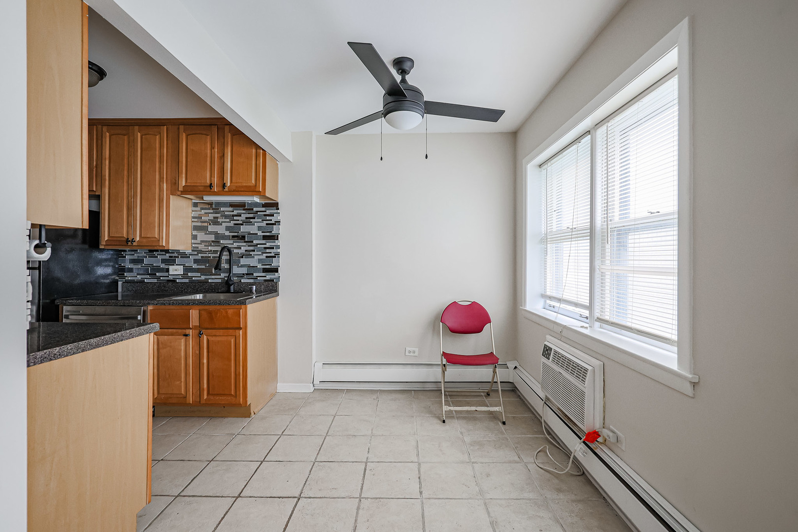 10016 South Pulaski Road, Unit 3 Oak Lawn, IL 60453 - Photo 13 of 39 a kitchen with stainless steel appliances a stove a sink cabinets and a window