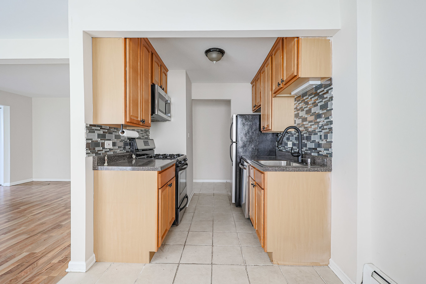 10016 South Pulaski Road, Unit 3 Oak Lawn, IL 60453 - Photo 20 of 39 a kitchen with stainless steel appliances a refrigerator and a stove