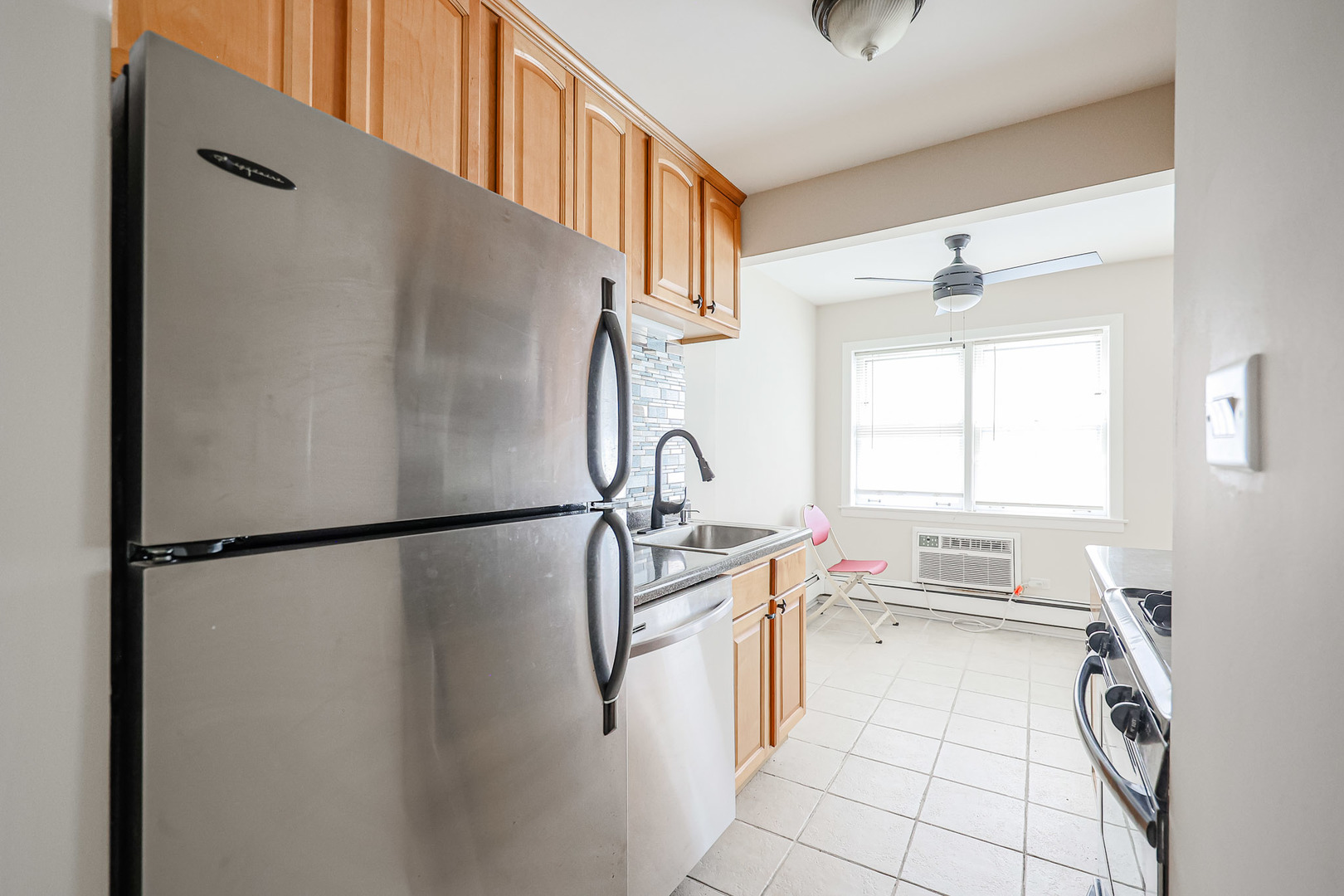 10016 South Pulaski Road, Unit 3 Oak Lawn, IL 60453 - Photo 23 of 39 a kitchen with stainless steel appliances a refrigerator sink and cabinets