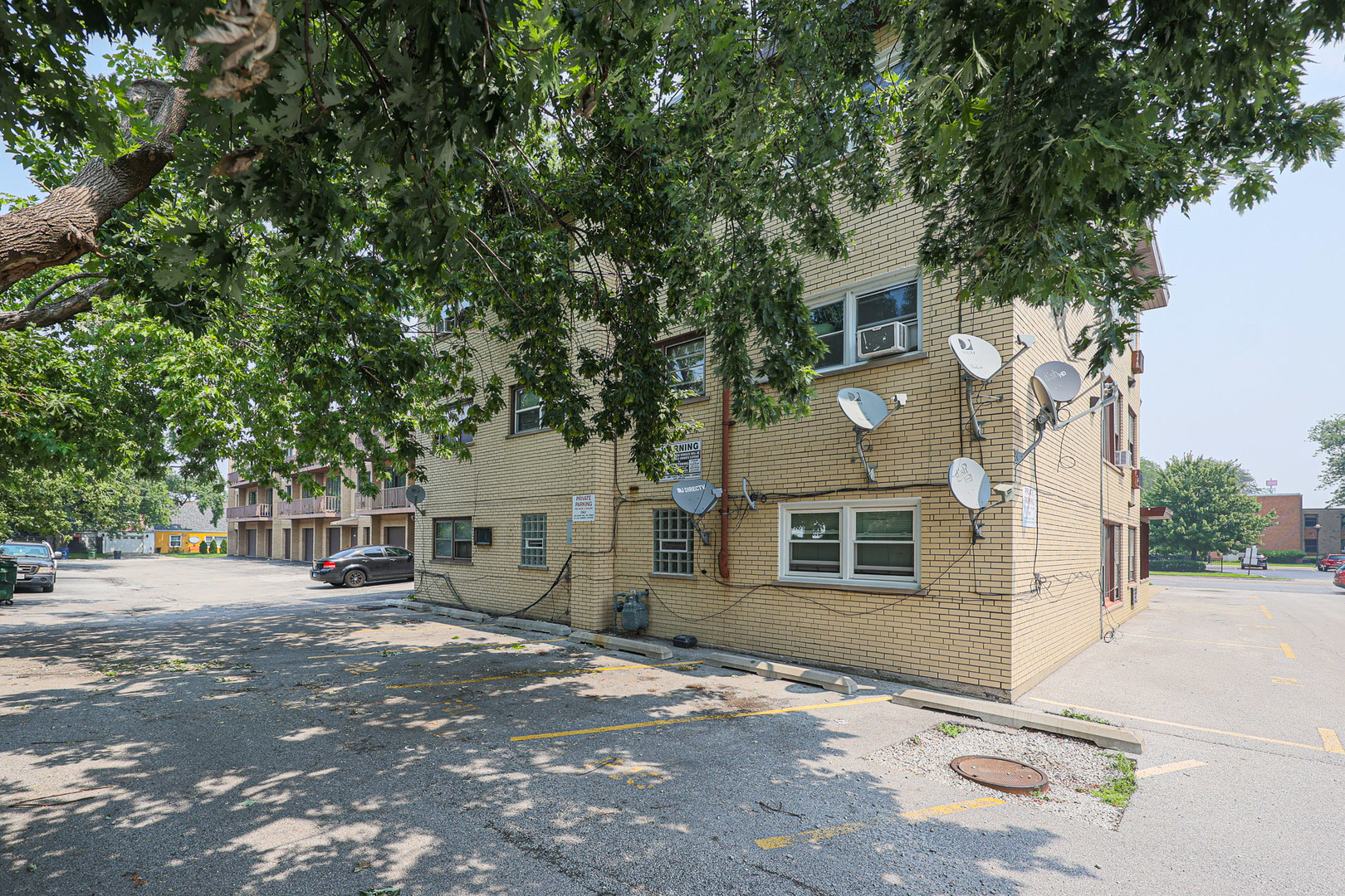 10016 South Pulaski Road, Unit 3 Oak Lawn, IL 60453 - Photo 38 of 39 a front view of a house with a tree