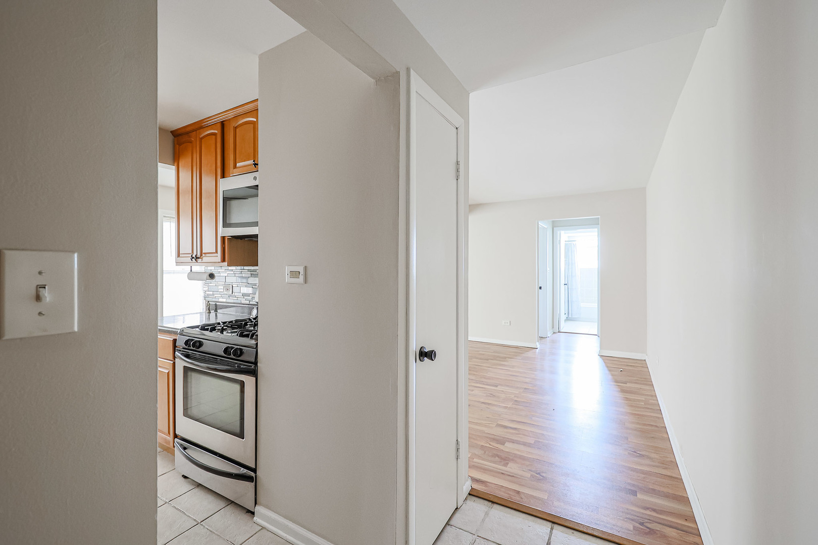 10016 South Pulaski Road, Unit 3 Oak Lawn, IL 60453 - Photo 7 of 39 a view of kitchen with wooden floor electronic appliances and window