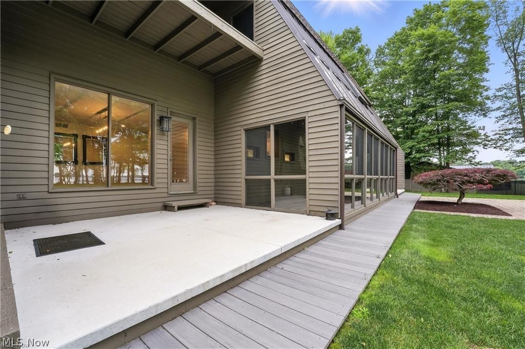 263 East Pine Lake Road North Lima, OH 44452 - Photo 4 of 50 Terrace featuring a sunroom, a yard, and a patio