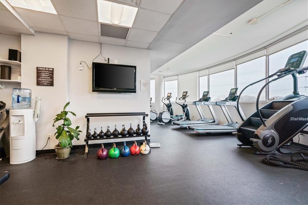 603 Davis Street, Unit 712 Austin, TX 78701 - Photo 19 of 22 a living room with furniture and a flat screen tv