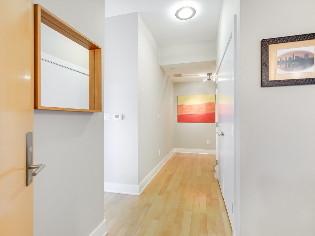 603 Davis Street, Unit 712 Austin, TX 78701 - Photo 2 of 22 a view of a bathroom from a hallway