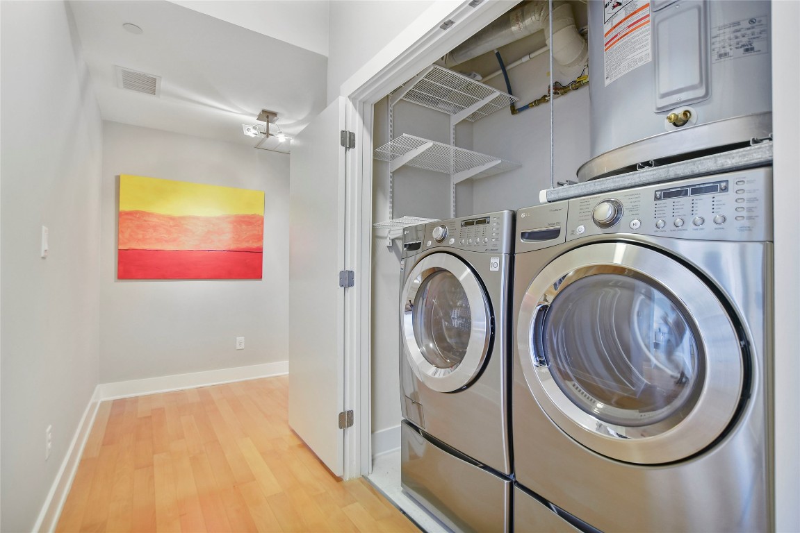 603 Davis Street, Unit 712 Austin, TX 78701 - Photo 3 of 22 a bathroom with a washer and dryer