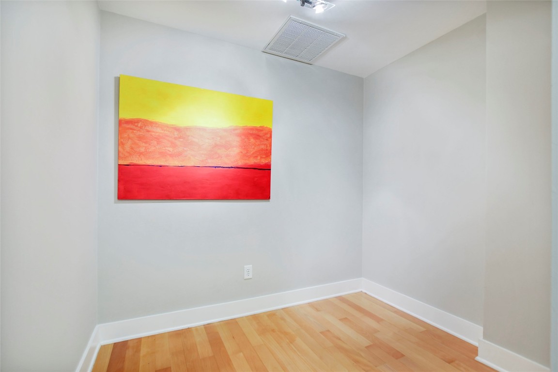 603 Davis Street, Unit 712 Austin, TX 78701 - Photo 4 of 22 a bathroom with a sink and a mirror