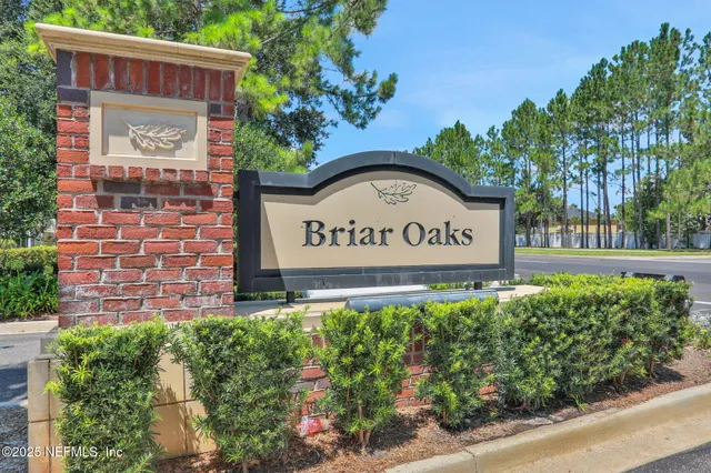 a kitchen with a sink stove and microwave