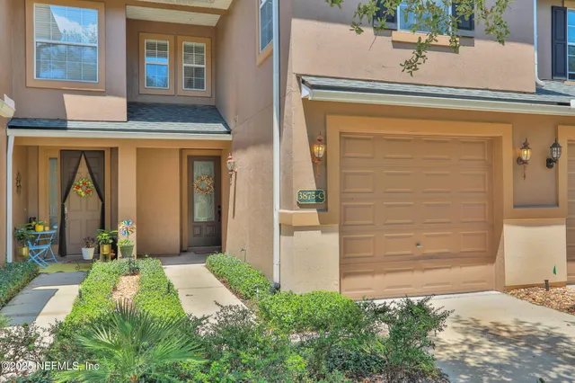 a kitchen with a sink refrigerator and microwave