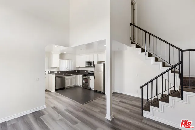 a view of kitchen with oven and refrigerator
