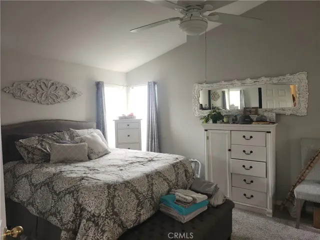 a bedroom with a bed and furniture