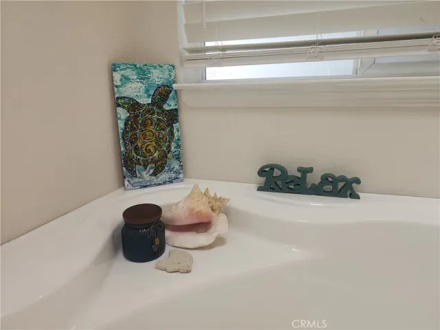 a white bath tub sitting in a bathroom