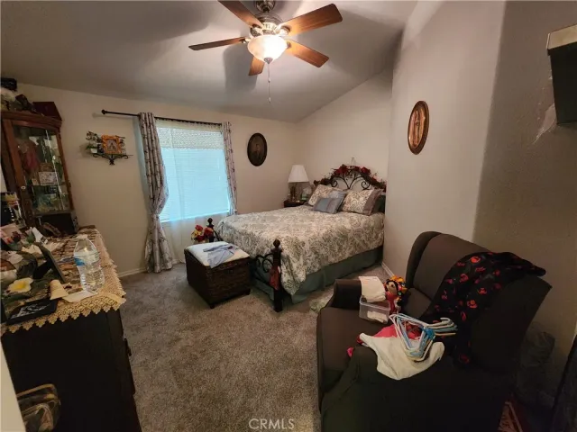 a bedroom with furniture and a bed