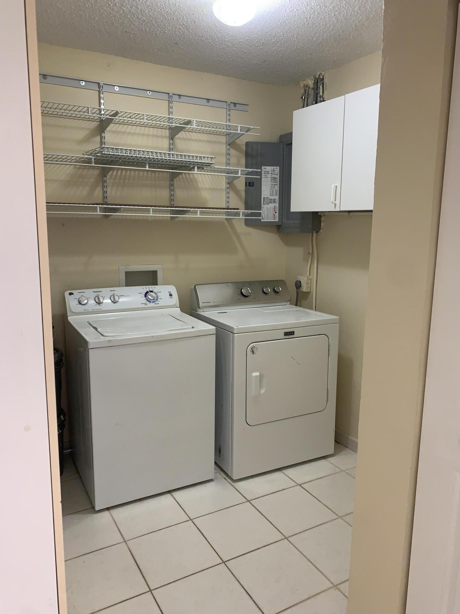 2822 Duke Lane Delray Beach, FL 33445 - Photo 6 of 12 a utility room with sink dryer and washer