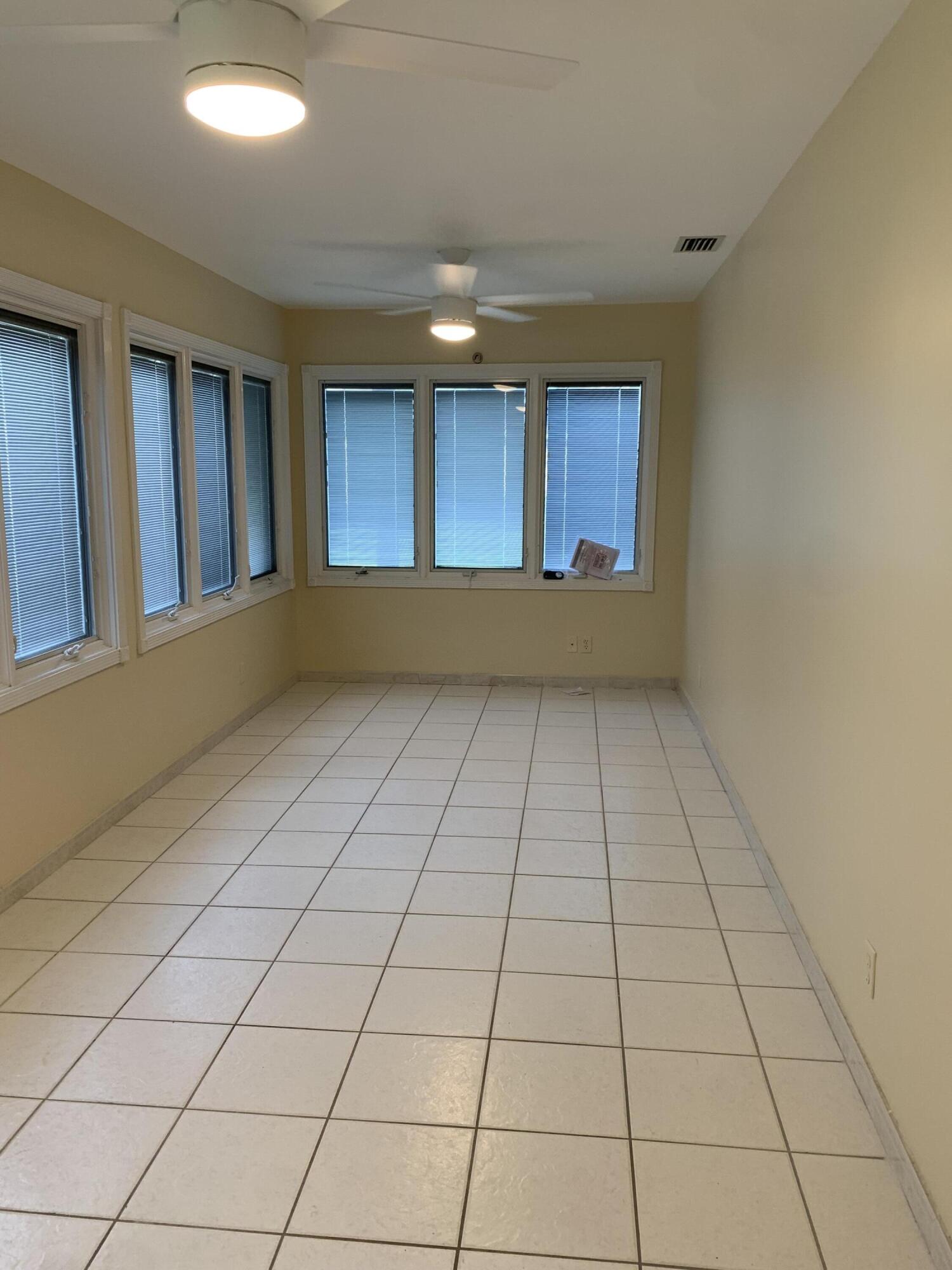 2822 Duke Lane Delray Beach, FL 33445 - Photo 7 of 12 a view of an empty room and window
