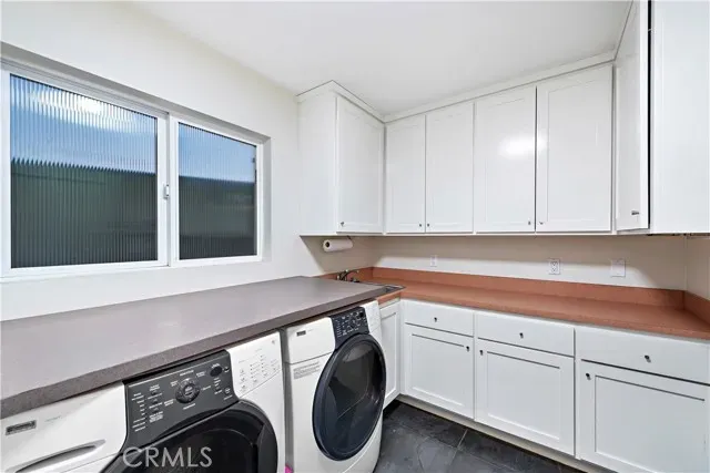 a bedroom with furniture and a ceiling fan