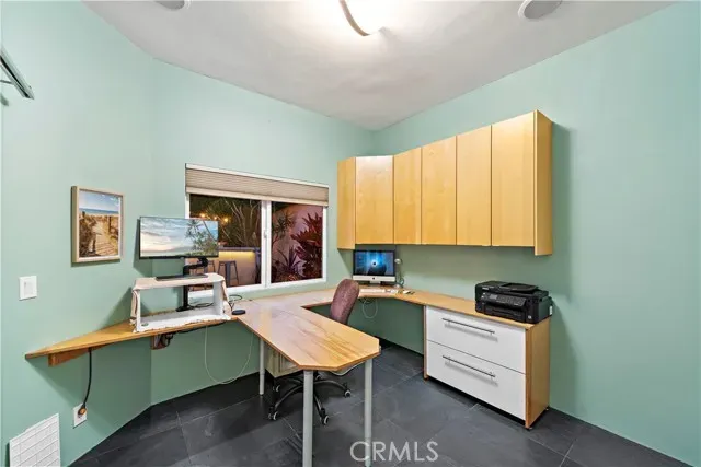 a living room with furniture ceiling fan and a window