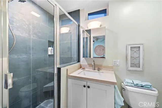 a bedroom with a bed and a desk