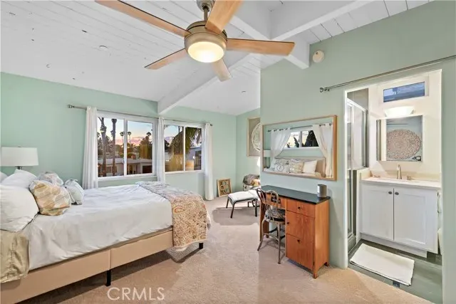 a bathroom with double vanity sink and a mirror
