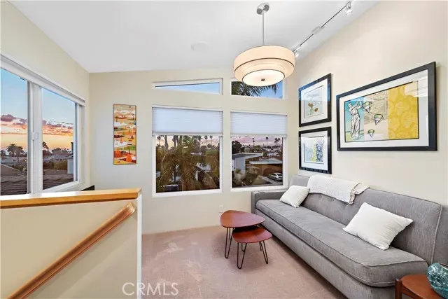 a terrace with outdoor seating and city view