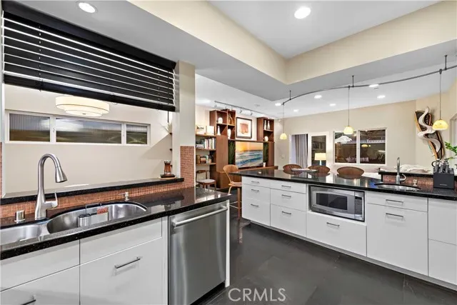 a kitchen with a sink and cabinets