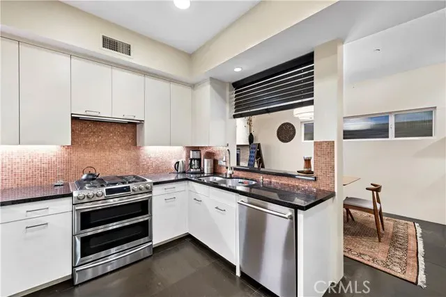 a room with furniture pool table and a window