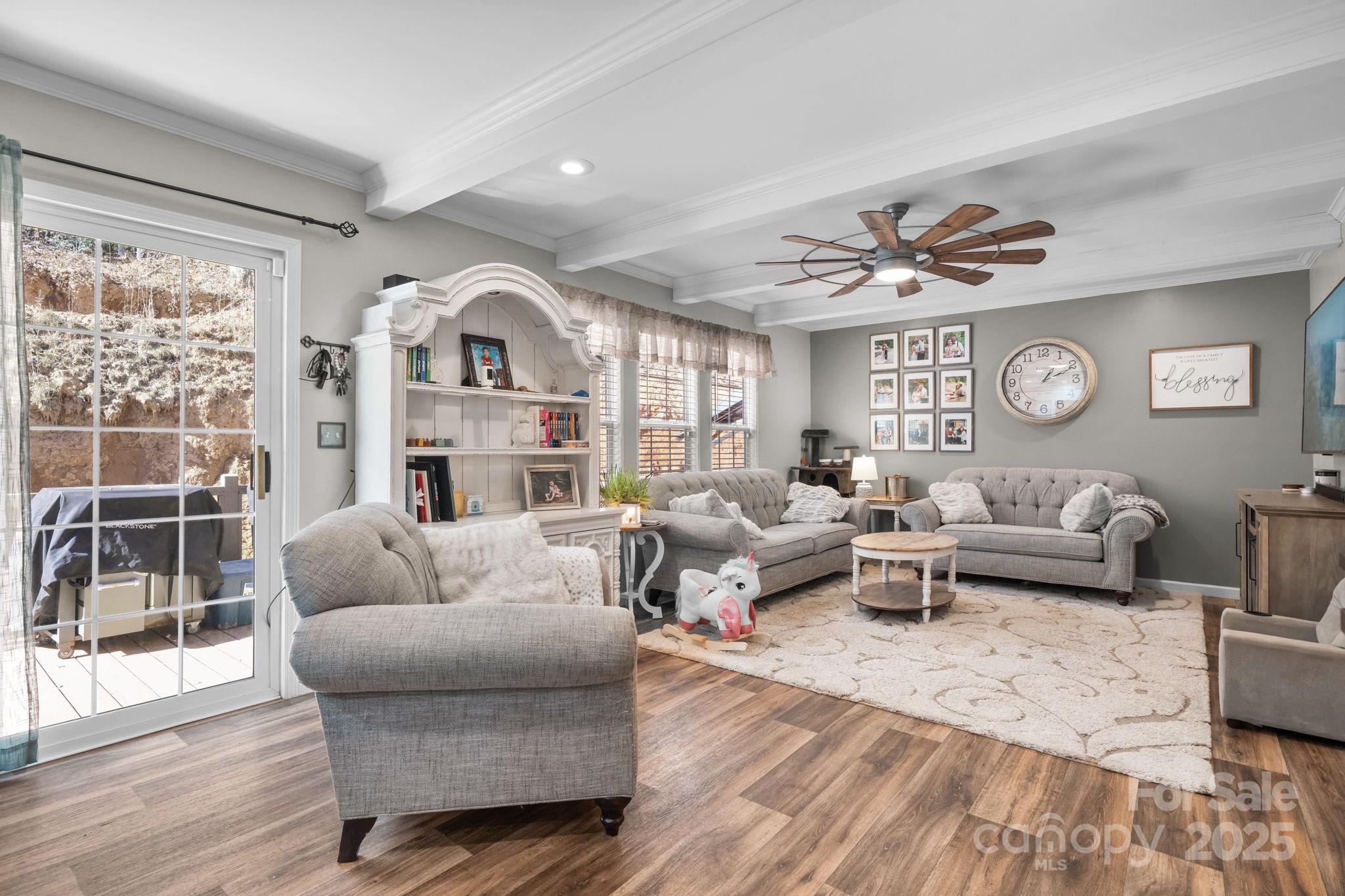 2603 Setzers Gap Road Lenoir, NC 28645 - Photo 11 of 29 a living room with furniture and a large window