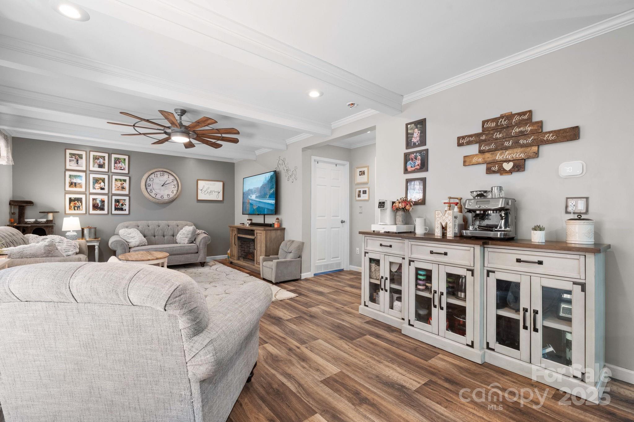2603 Setzers Gap Road Lenoir, NC 28645 - Photo 12 of 29 a living room with furniture a rug and wooden floor