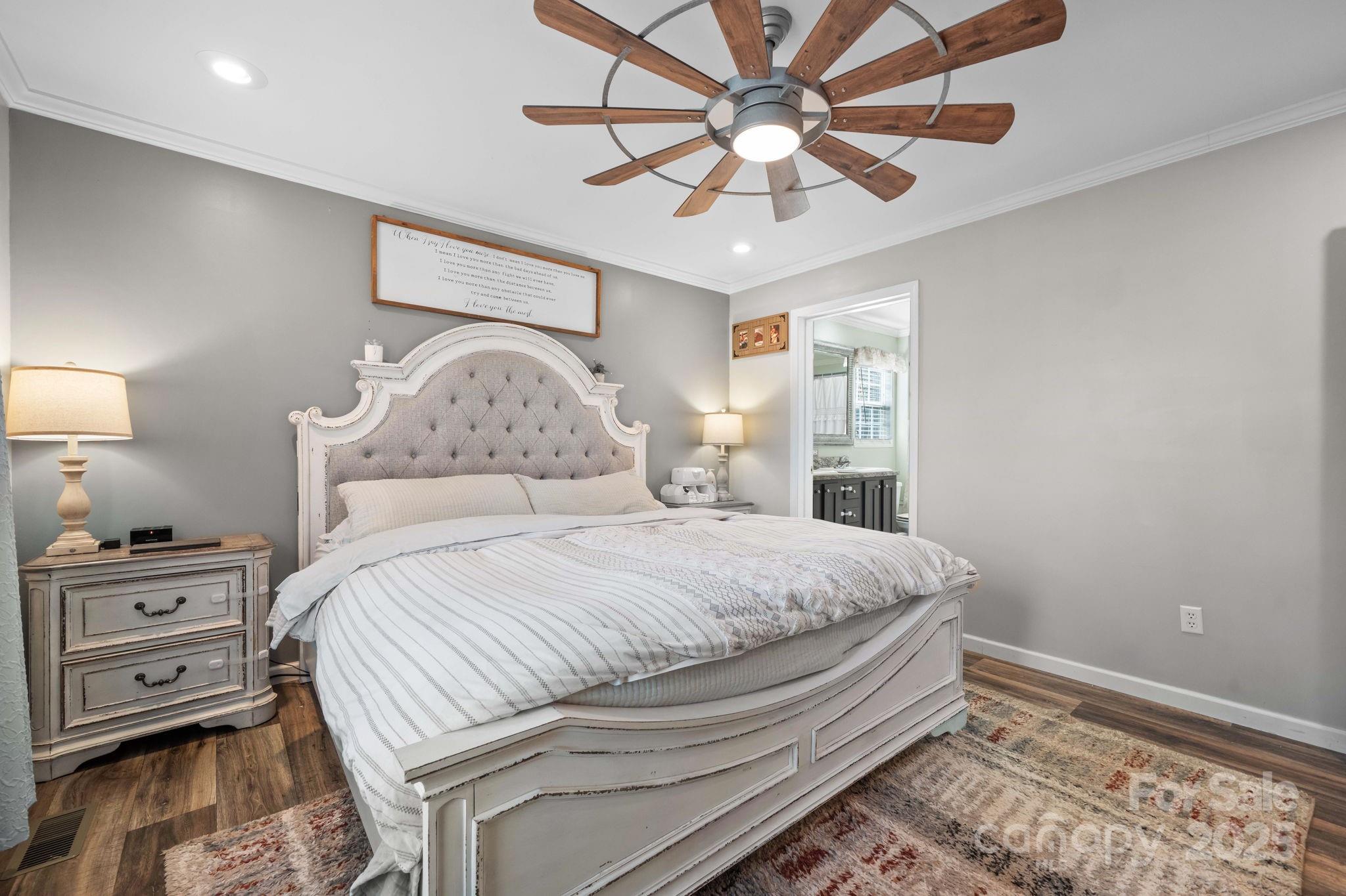 2603 Setzers Gap Road Lenoir, NC 28645 - Photo 14 of 29 a bedroom with a bed and a tv