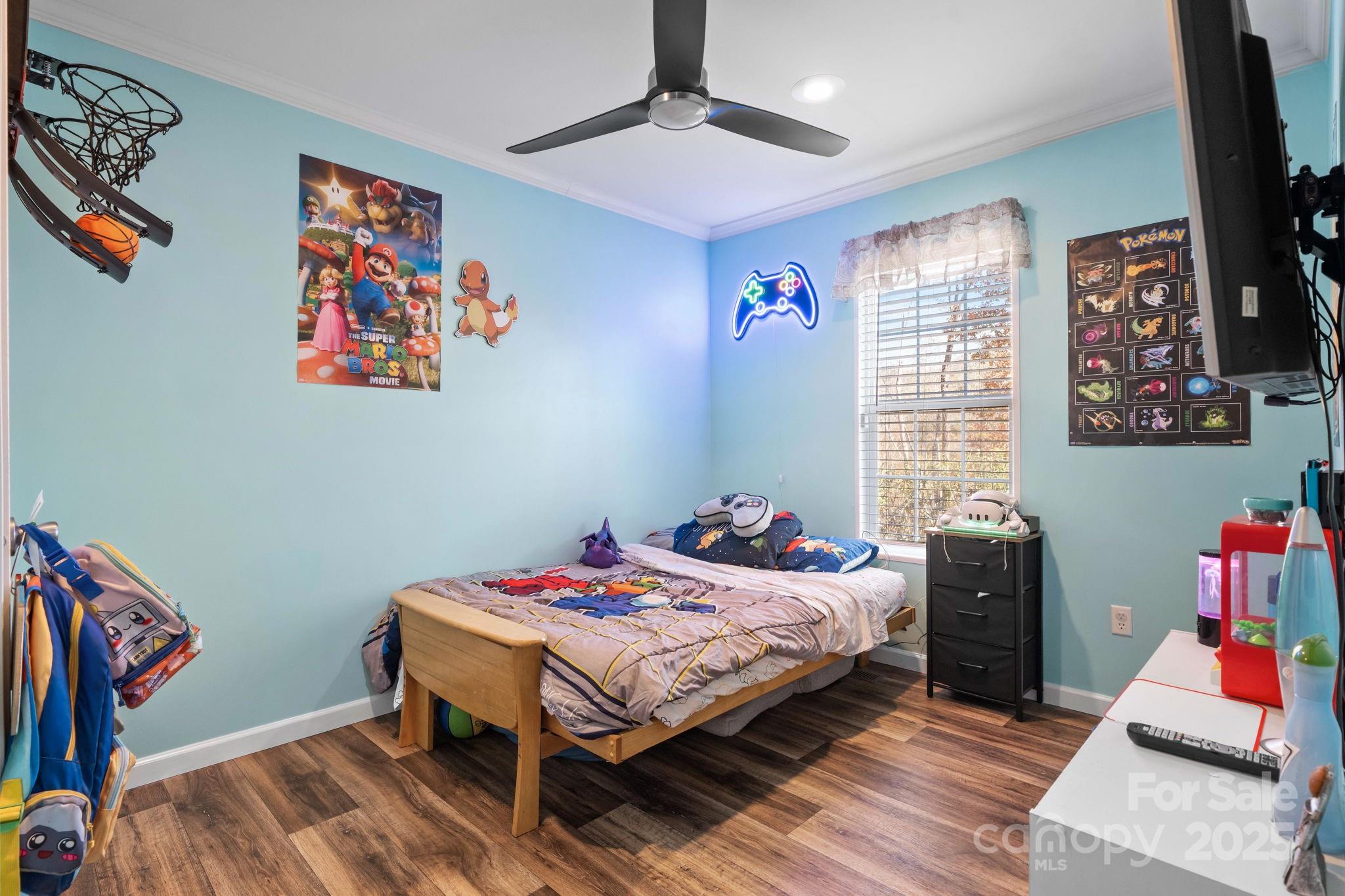 2603 Setzers Gap Road Lenoir, NC 28645 - Photo 16 of 29 a bedroom with a bed and wooden floor